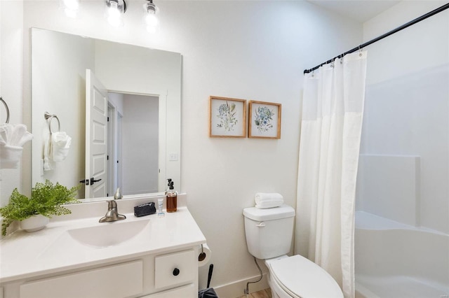 full bathroom with curtained shower, vanity, and toilet