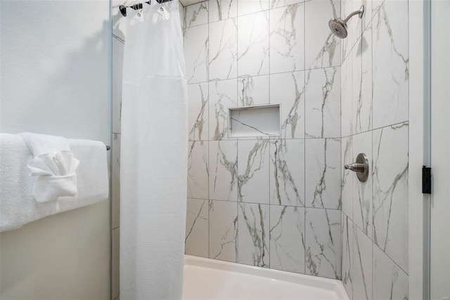 full bath featuring a tile shower