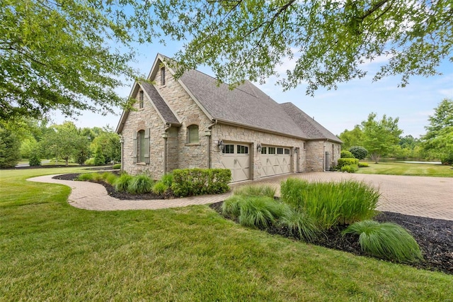 view of property exterior featuring a yard and a garage