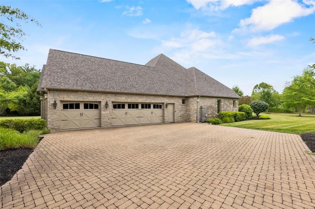 exterior space with a front lawn and a garage