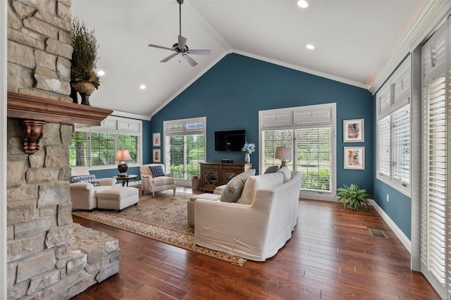 living room with plenty of natural light, dark wood-type flooring, high vaulted ceiling, and ceiling fan