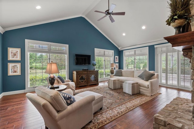 living room featuring ceiling fan, dark wood-type flooring, ornamental molding, and high vaulted ceiling