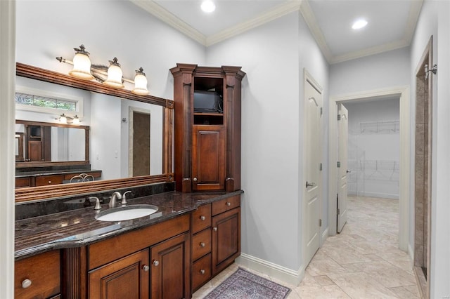 bathroom with ornamental molding, vanity, and tile flooring