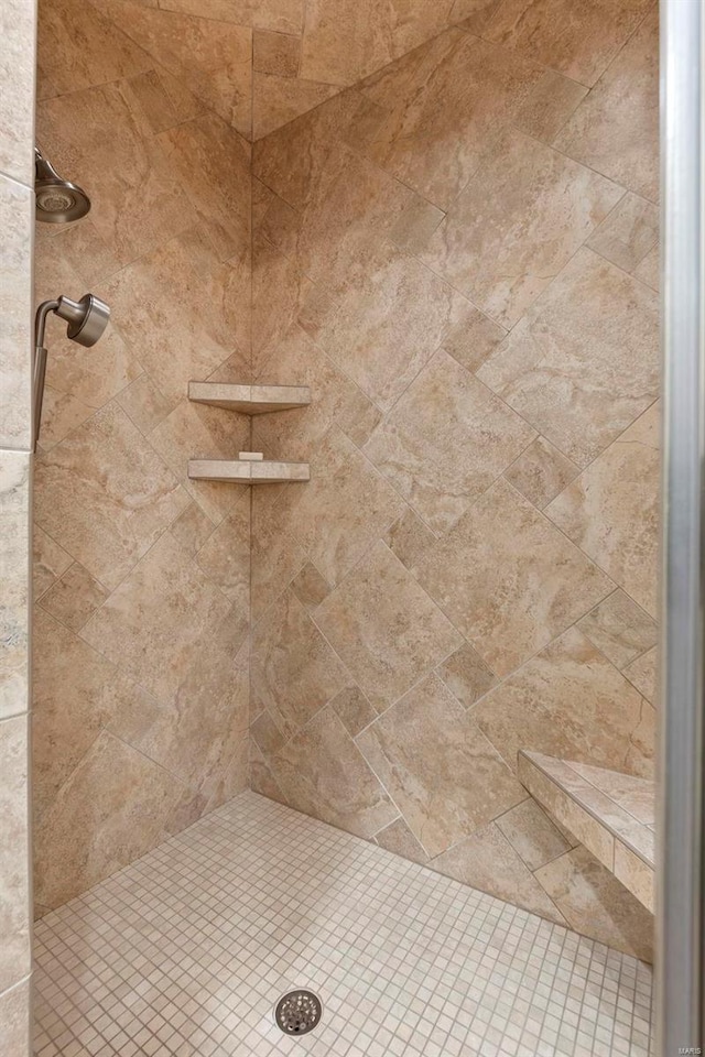 bathroom with tiled shower