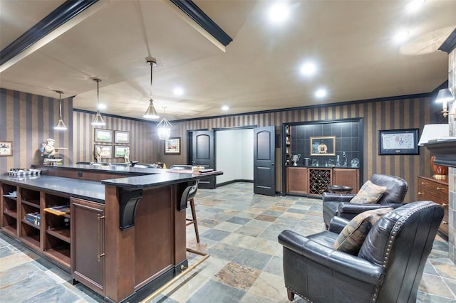 kitchen featuring light tile floors, a breakfast bar, and pendant lighting