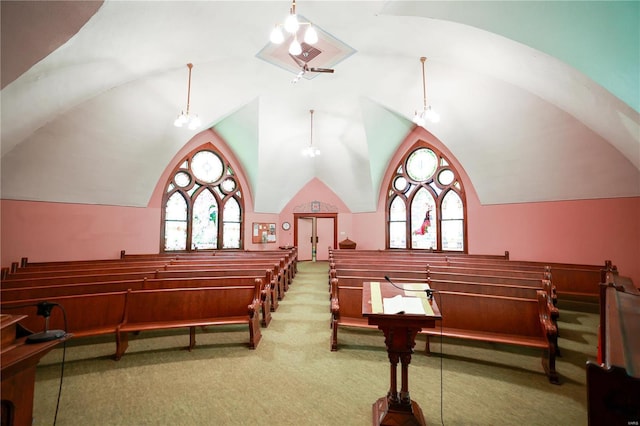 interior space with carpet flooring and lofted ceiling