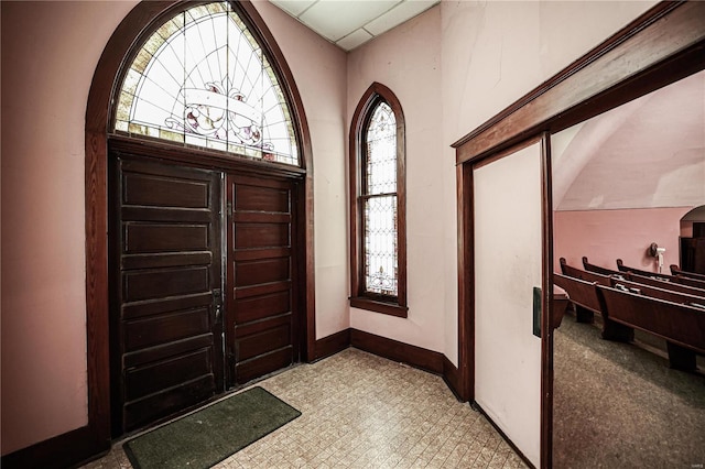 entrance foyer with light tile floors