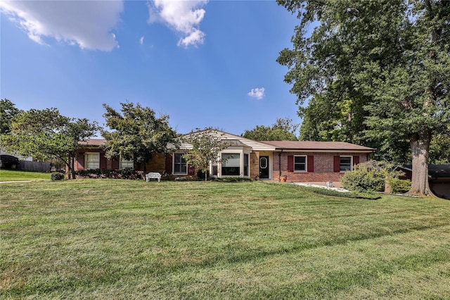 ranch-style home with a front yard