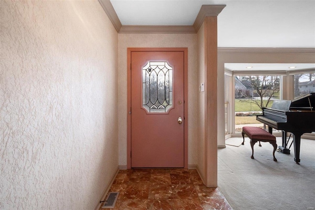 entryway featuring carpet and ornamental molding