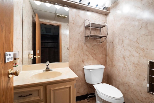 bathroom with toilet and vanity