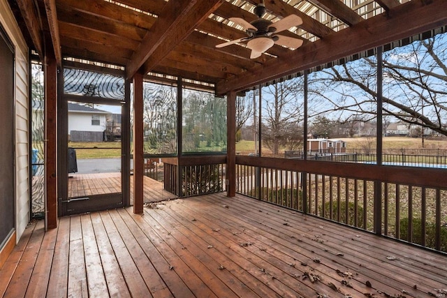 wooden terrace featuring a water view and ceiling fan