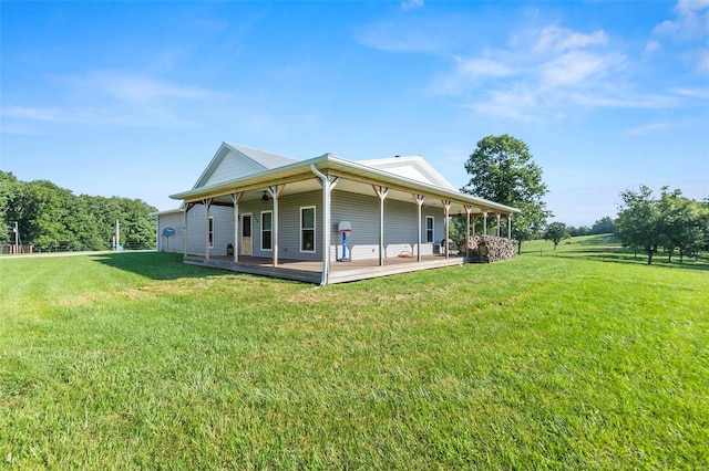 back of property featuring a yard