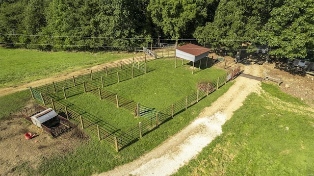 birds eye view of property with a rural view