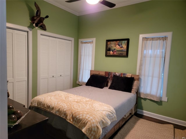 bedroom with two closets and ceiling fan