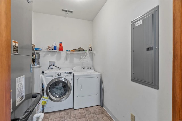 clothes washing area with hookup for a washing machine, heating utilities, and washing machine and clothes dryer