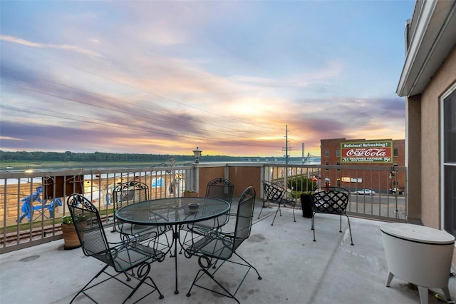 patio terrace at dusk with a water view