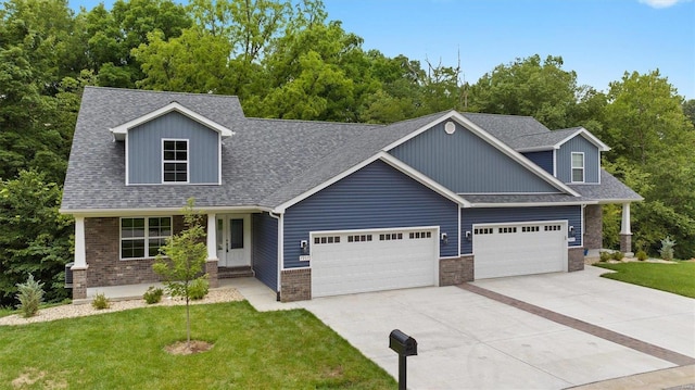 view of front of house with a garage and a front yard