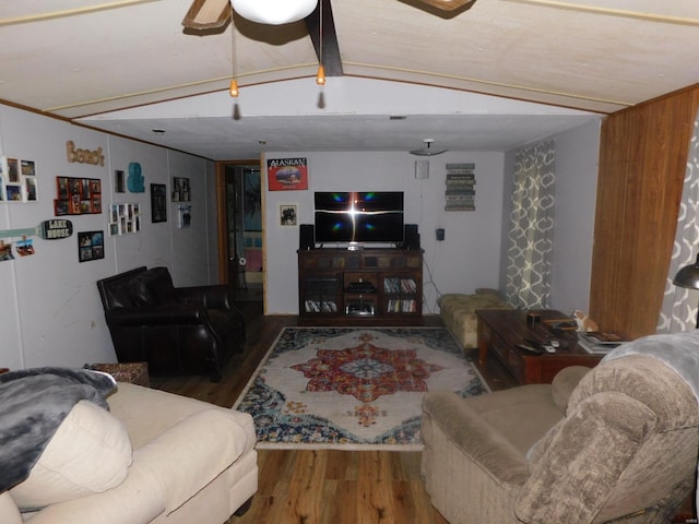 living room featuring vaulted ceiling, ceiling fan, and dark hardwood / wood-style flooring