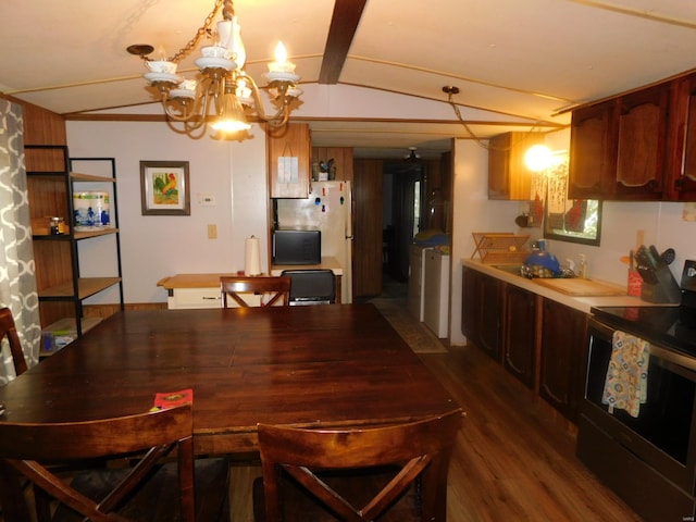 dining area with dark hardwood / wood-style flooring and a notable chandelier