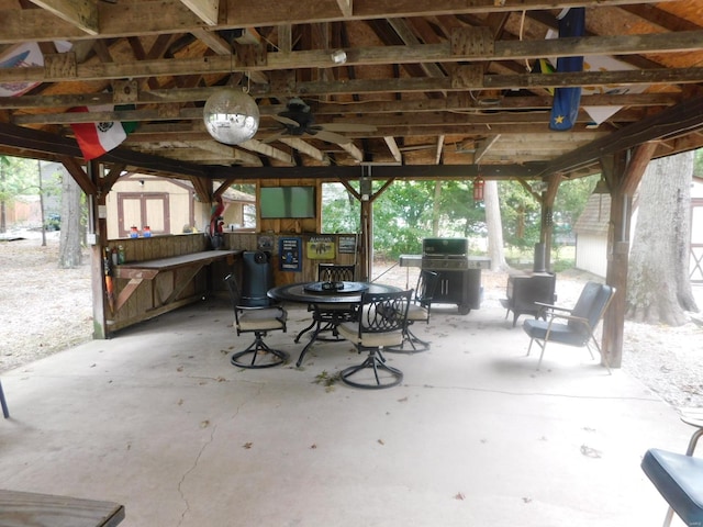 view of patio / terrace featuring area for grilling and ceiling fan