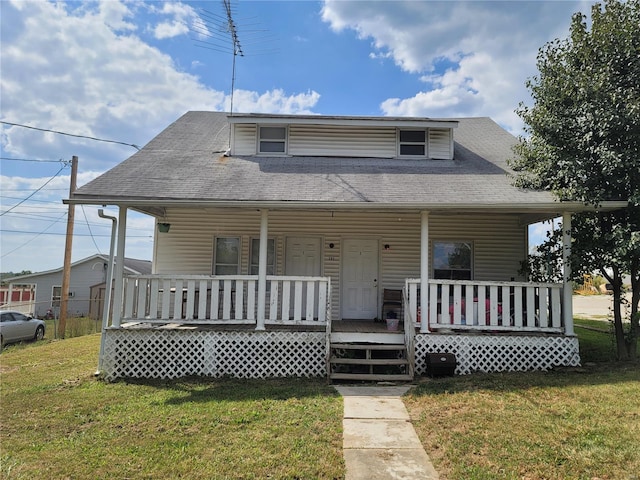 view of front of home featuring a front yard and a porch