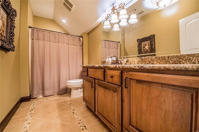 bathroom featuring toilet, lofted ceiling, vanity with extensive cabinet space, and tile flooring