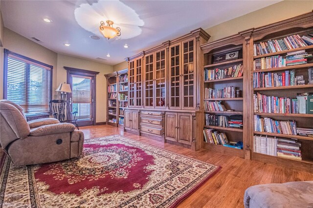 sitting room with light hardwood / wood-style flooring