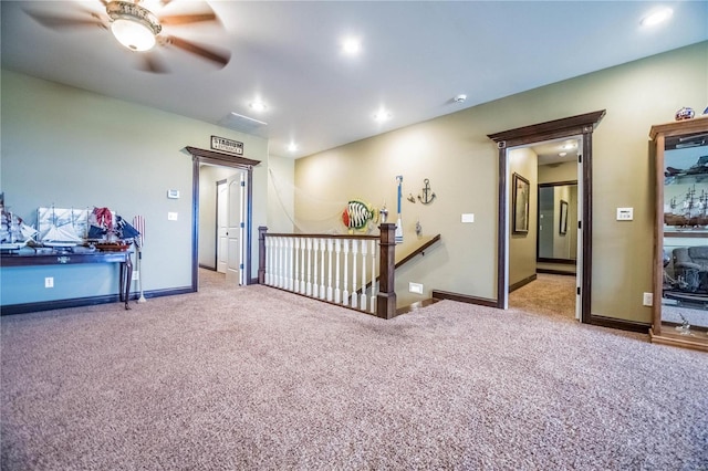 interior space with ceiling fan