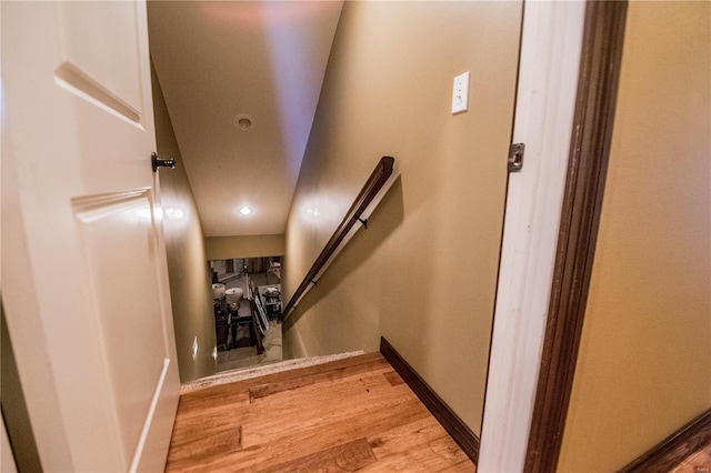 staircase with light hardwood / wood-style flooring