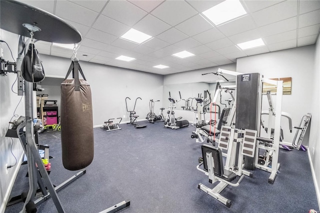 exercise room featuring a paneled ceiling