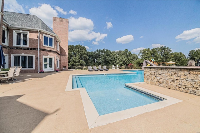 view of pool featuring a patio area