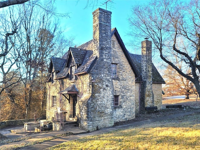 view of side of property with a yard