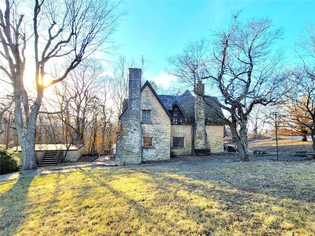 view of home's exterior with a yard