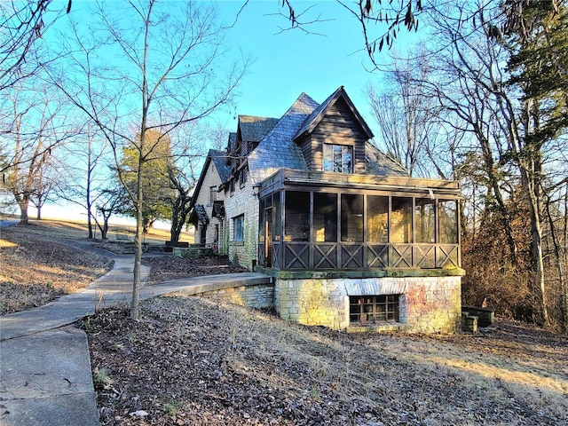 view of front of property with a sunroom