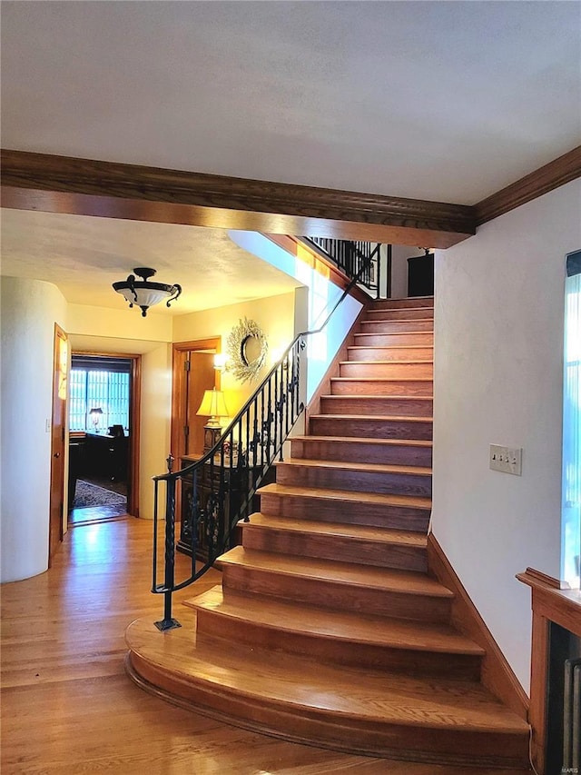 stairway featuring hardwood / wood-style floors