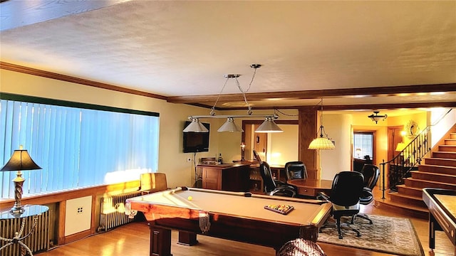 recreation room featuring hardwood / wood-style floors, radiator heating unit, crown molding, and billiards