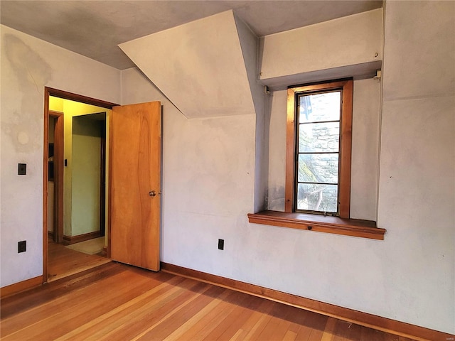 spare room with hardwood / wood-style floors