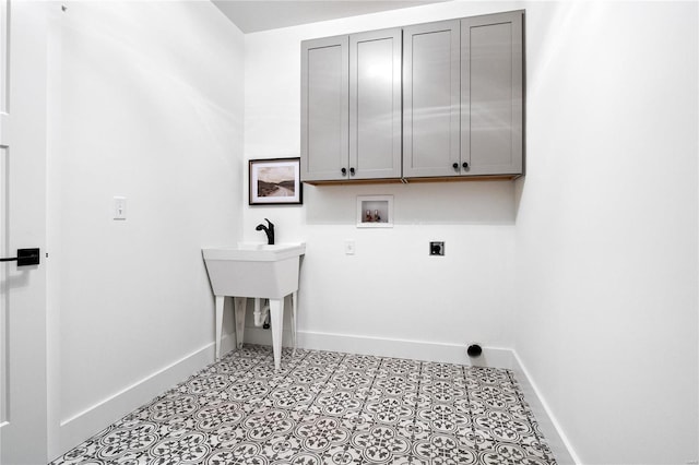 laundry room featuring washer hookup, cabinets, electric dryer hookup, and light tile floors