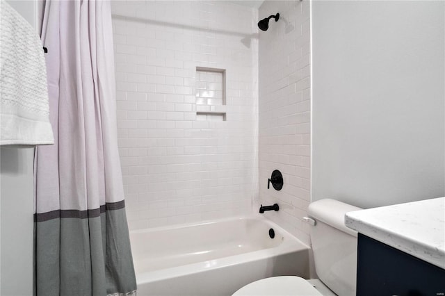 full bathroom with shower / bath combo with shower curtain, toilet, and vanity