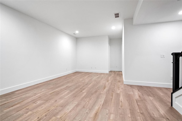 unfurnished room featuring light hardwood / wood-style floors