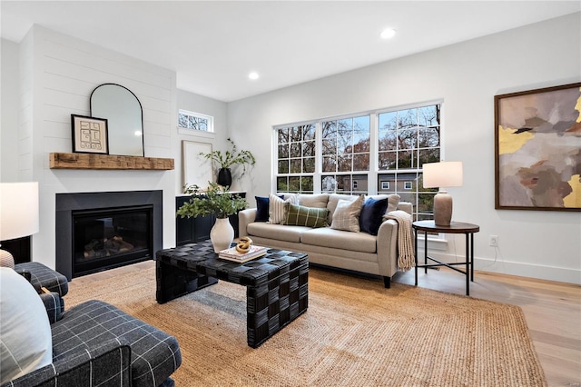 living room with light hardwood / wood-style flooring