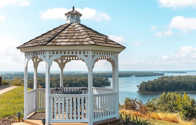 exterior space featuring a water view and a gazebo