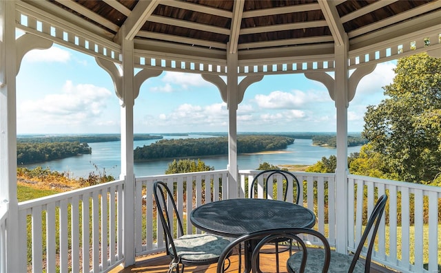 exterior space with a water view and a gazebo