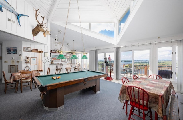 rec room featuring high vaulted ceiling, dark carpet, pool table, and a wealth of natural light