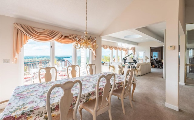 dining space with vaulted ceiling, light carpet, and a chandelier