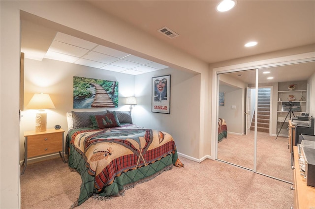 carpeted bedroom with a closet