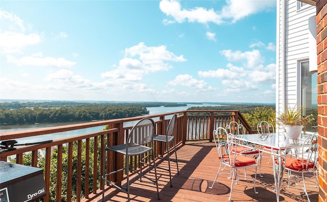 wooden deck featuring a water view