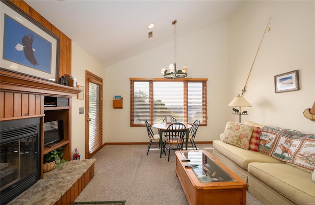 carpeted living room with a notable chandelier and high vaulted ceiling