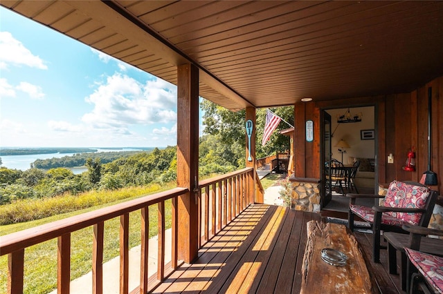 wooden terrace with a water view