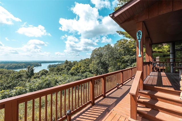 wooden deck with a water view